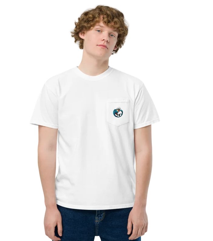 White pocket tee featuring a small, circular crest logo printed directly on the left chest pocket depicting a hooked fish leaping out of a blue wave.